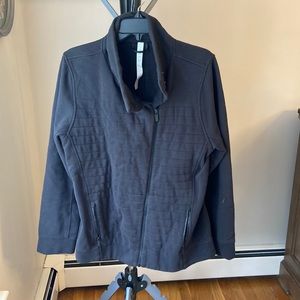 Zip up jacket with 2 snap closure at the top